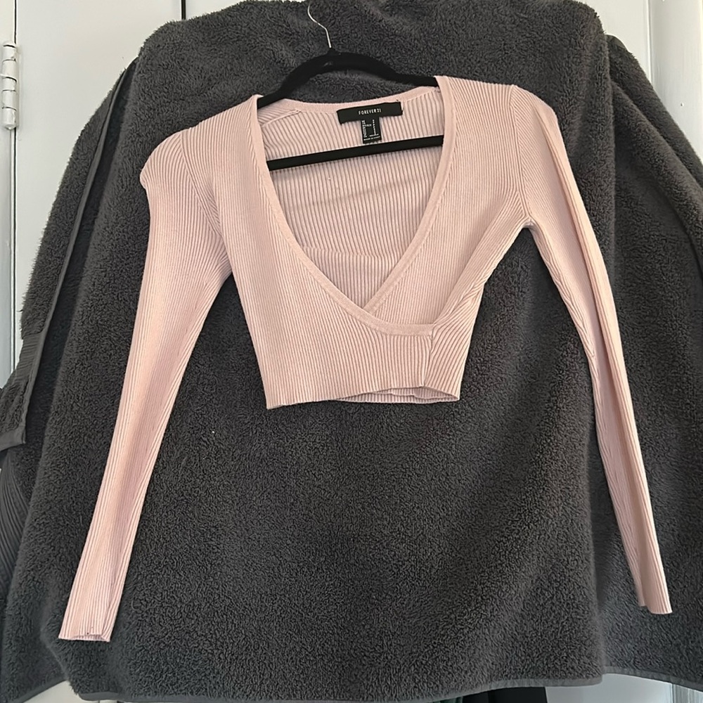 Light pink color,stretchy and well- fitted, open front crossover, crop top